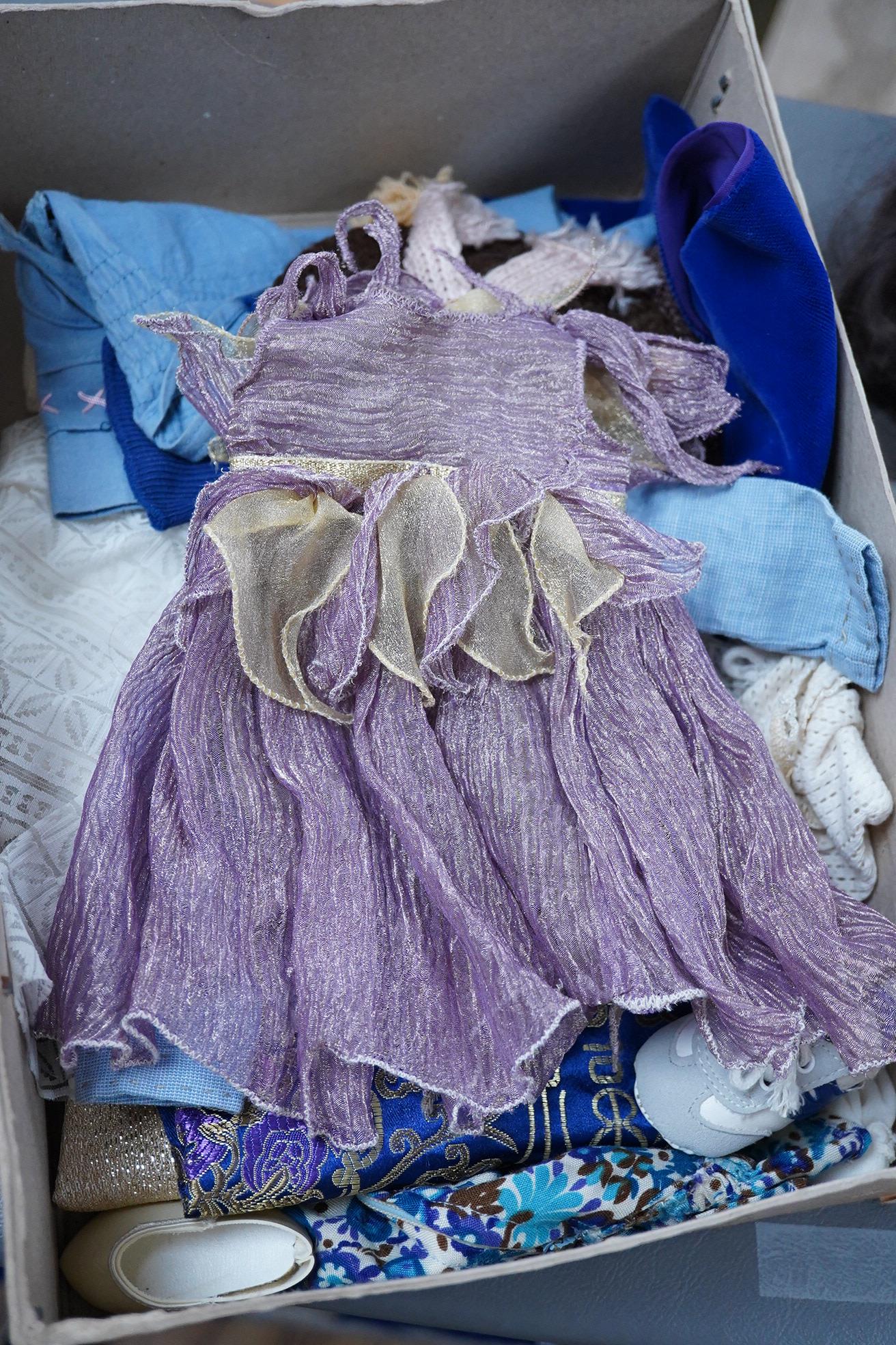 A Sasha Doll, 42cm high, with a selection of clothes, including some possible original commercially produced clothes together with other handmade clothes
